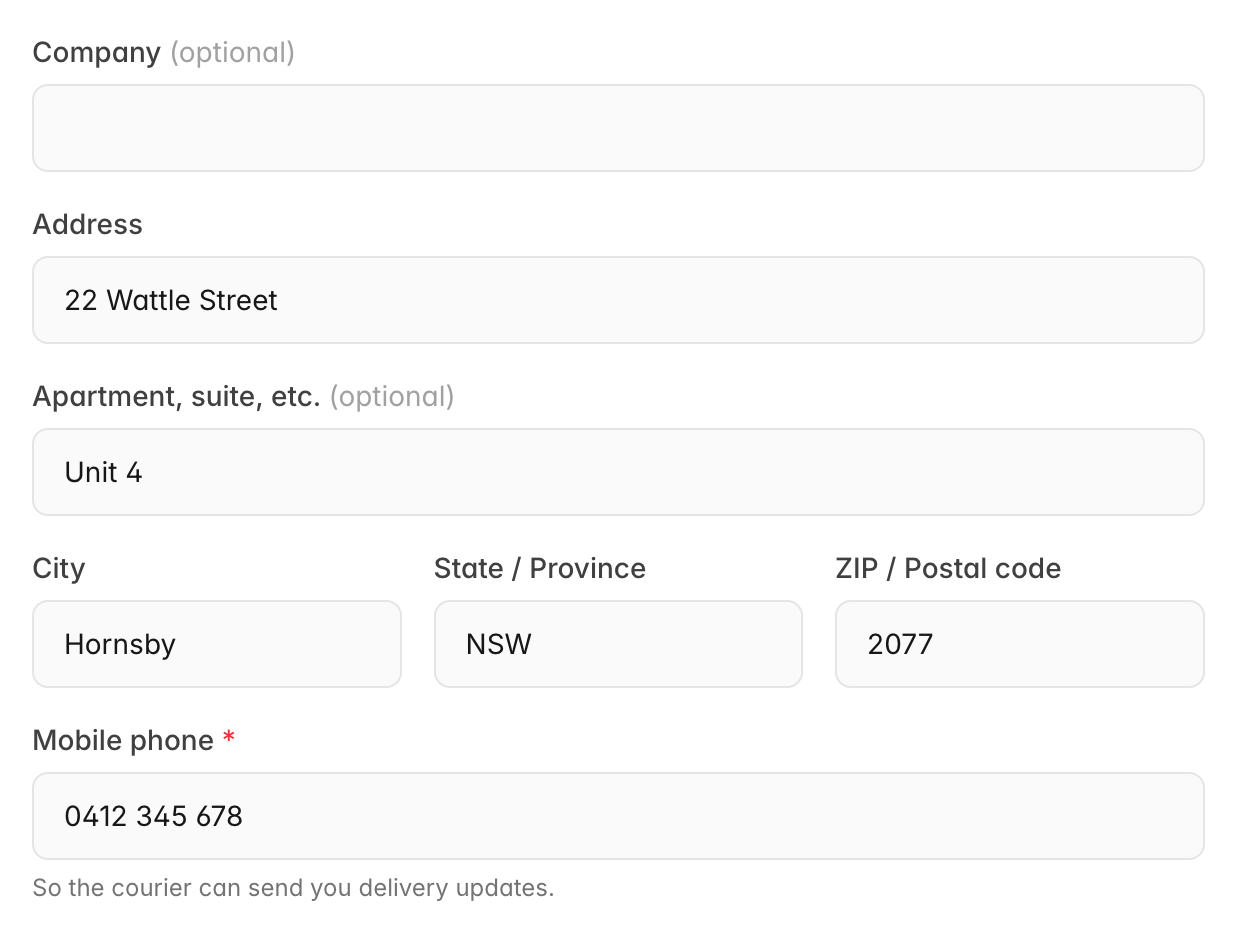 Checkout shipping address fields: Company (optional), Address 22 Wattle Street, Apartment, suite, etc. Unit 4, City Hornsby, State NSW, Postcode 2077, and Mobile phone 0412 345 678 with the hint So the courier can send you delivery updates