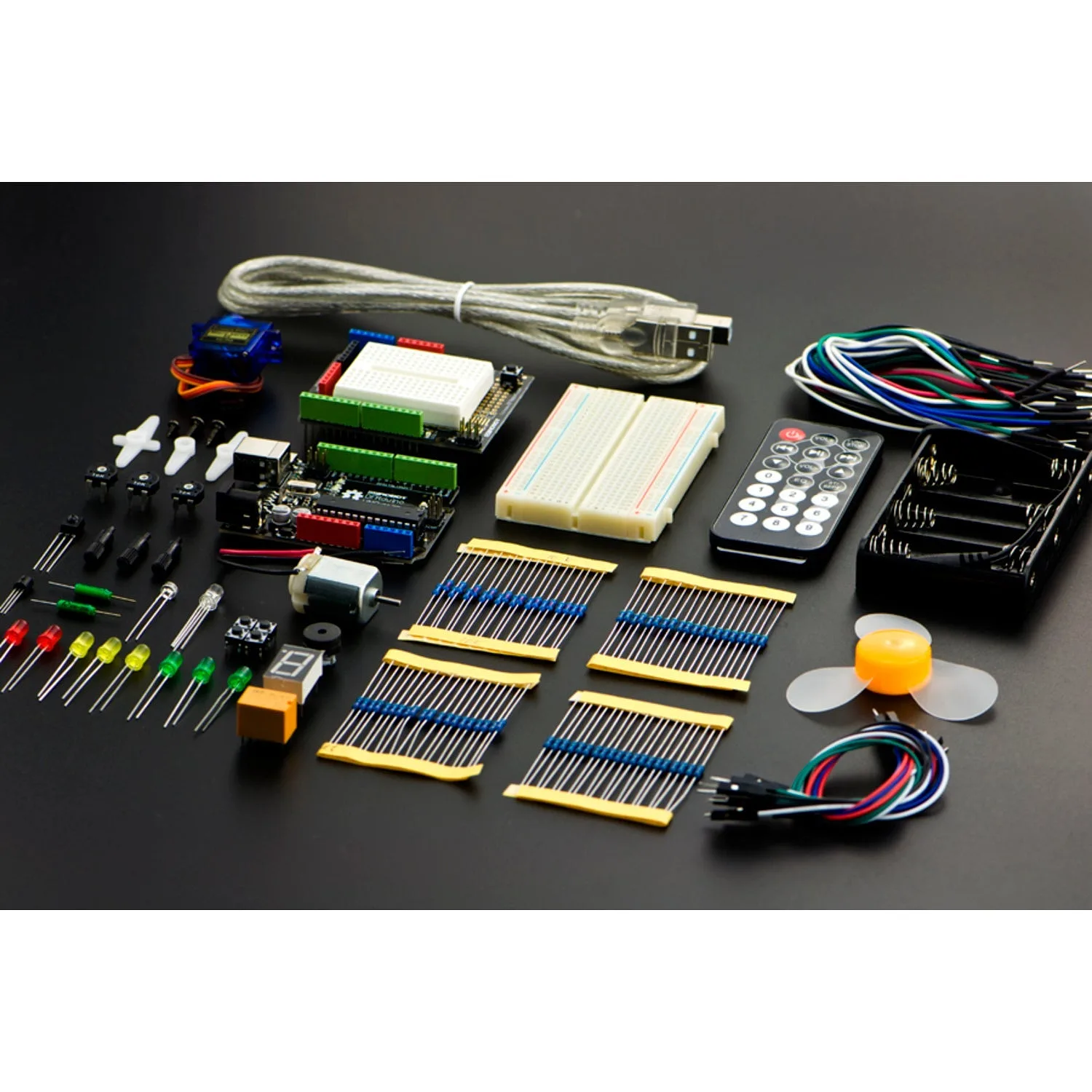 Contents of the DFRobot Beginner Kit for Arduino Uno laid out on a dark surface